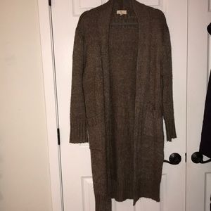 Long goldish brown sweater.